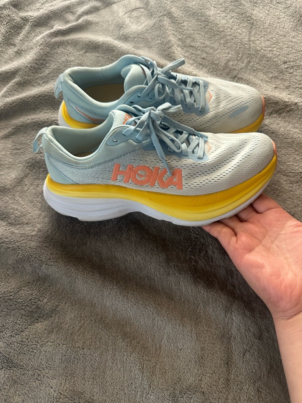 Hoka Light Blue Running Shoes with Yellow Midsole and Pink Logo